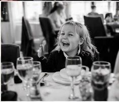Natural candid photograph of a child laughing